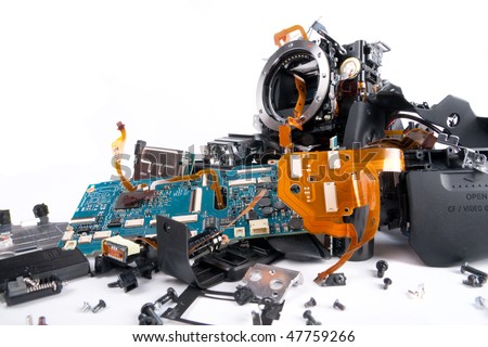 Broken and disassembled DSLR photo camera