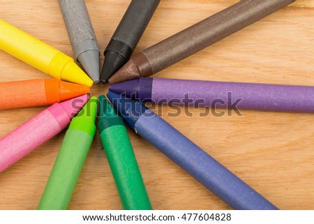 The colorful crayon on the wooden background, Multicolored Crayons 