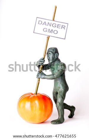 GMO concept danger figure of a man holding a poster