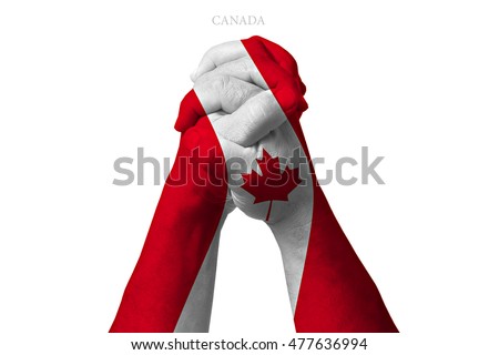 Man clasped hands patterned with the CANADA flag