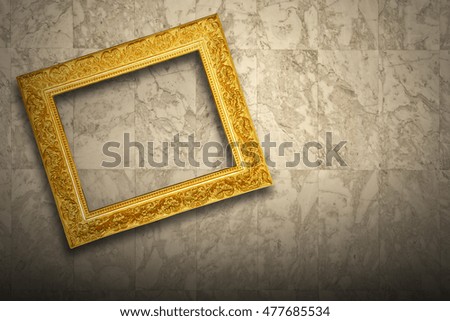 Antique old picture frame on marble wall
