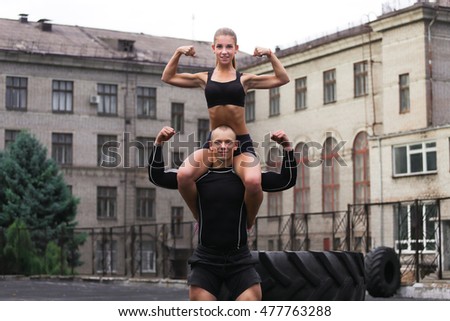 Athlete muscular sportsmen man and woman young couple Crossfit fitness sport training lifestyle bodybuilding concept