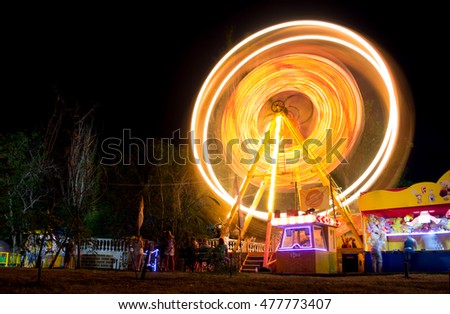 Ferris wheel at an amusement park. Long exposure