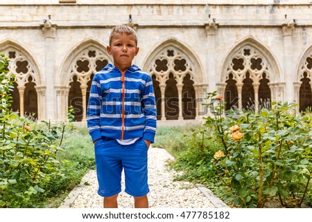 Boy in Poblet Monastery in summer, Spain