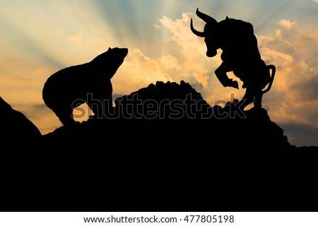 The silhouette of a bear and bull. Royalty-Free Stock Photo #477805198
