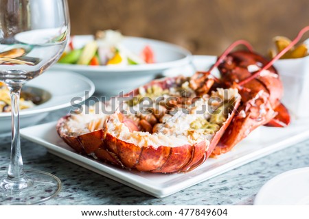 Canadian Lobster on dinner Royalty-Free Stock Photo #477849604