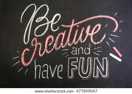 Quote - Be creative and have fun - on black chalkboard handwritten by pink and white chalks