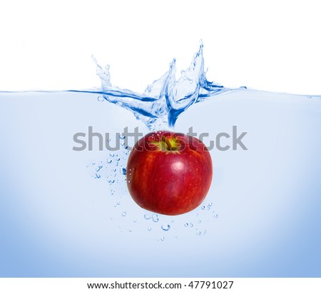 red apple thrown into the water