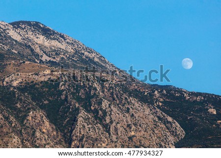 KALAMATA - GREECE AUGUST 2016: Full moon rising above the Taygetos Mountain over Kato Verga near Kalamata, Greece