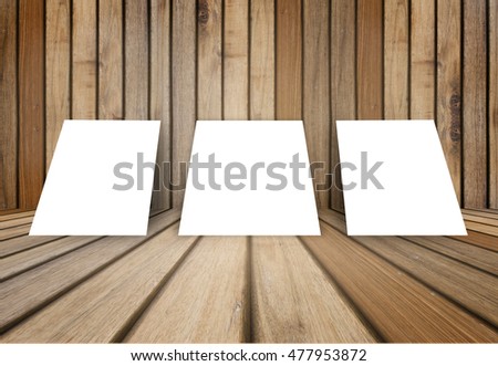 three empty white poster frame put on old grunge texture wooden interior room for present product, perspective wooden floor and wall,template for your content