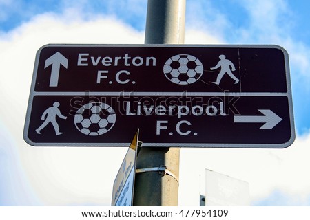 A sign explains the direction to Everton and Liverpool Football Club, England