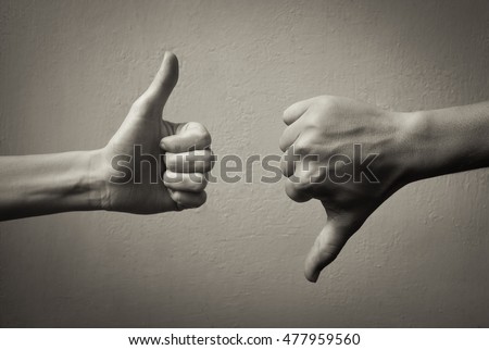 Thumbs up thumbs down. Yes and no concept.  Royalty-Free Stock Photo #477959560
