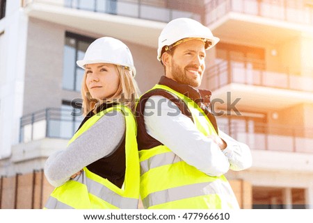View of Two workers checking last details on a construction site