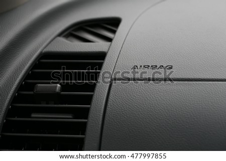 Air conditioner and The word Airbag is written on a car's dashboard Royalty-Free Stock Photo #477997855