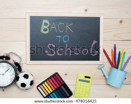 Back to school concept. School supplies on wooden table