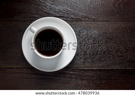 Top view black coffee on wood table with copy space.