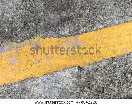 Concrete road with yellow stripe