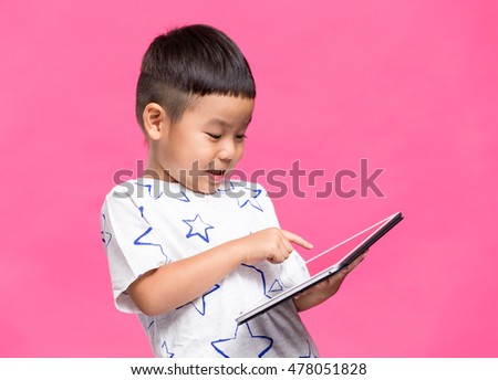 Young kid using digital tablet computer