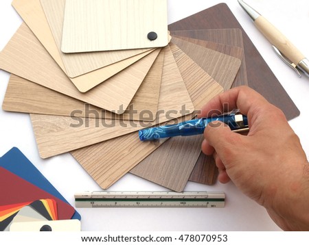 renovation: interior designer working with timber samples palette   