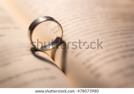Ring with love shape, hearth shadow in a book