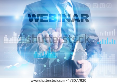 Businessman is pressing button on touch screen interface and selecting "Webinar".