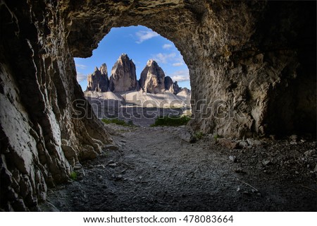 Interesting perspective of Tre Cime seen from a man-made cave. Italy. Dolomites. Cave. Nature. Man-Made  