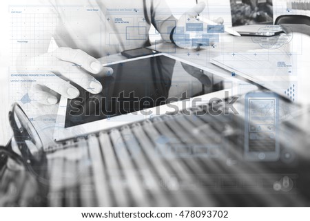 Photo creative designer work concept. Man working new startup project in modern studio.Digital tablet laptop computer design smart phone using.black white