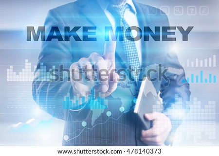 Businessman is pressing button on touch screen interface and selecting "Make money".