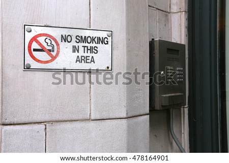 the sing no smoking area at the entrance