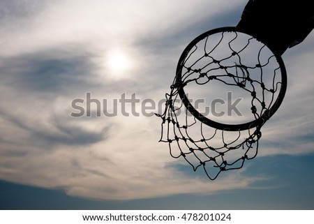 Silhouette of basketball hoop with nice sky background