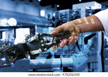 Cyber communication and robotic concepts. Industrial 4.0 Cyber Physical Systems concept. Robot and Engineerer human holding hand with handshake and graphic for background Royalty-Free Stock Photo #478206340