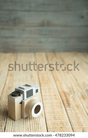Camera paper on the wood old background
