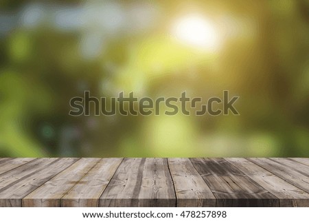 Wood table top on shiny bokeh abstract background - can used for display or montage your products