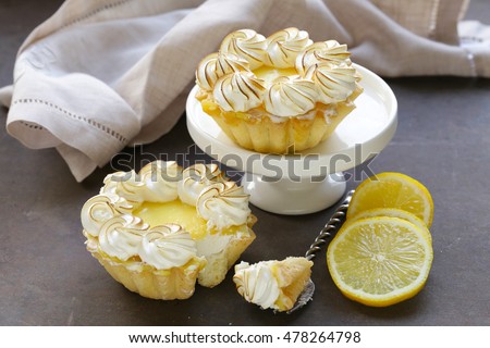 tartlet with lemon cream and meringue on a table