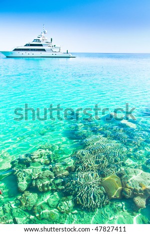 Yacht in coral sea