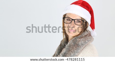 Beautiful woman wearing glasses and a christmas hat 