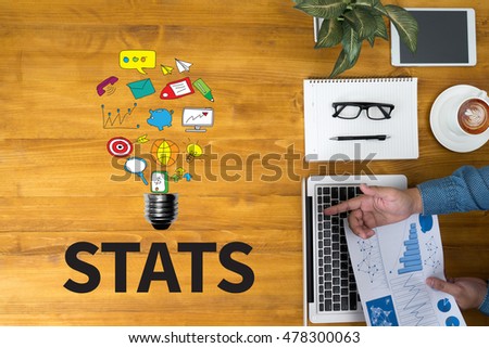 STATS Businessman working at office desk and using computer and objects, coffee, top view, with copy space