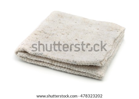 Folded rough cleaning rag isolated on white