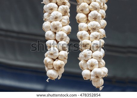 Garlic dry hanging in market selective focus
