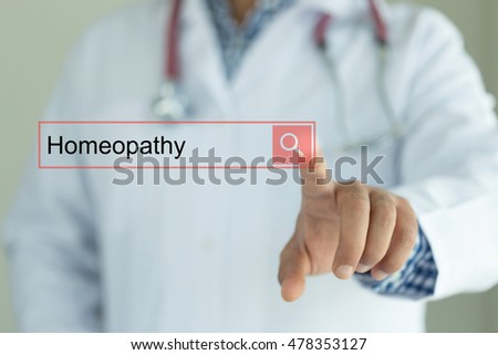 DOCTOR WORKING MODERN INTERFACE TOUCHSCREEN SEARCHING AND HOMEOPATHY  CONCEPT