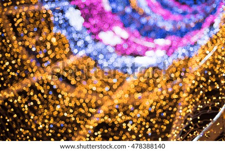 Gold and pink christmas lights background, abstract bokeh lights.