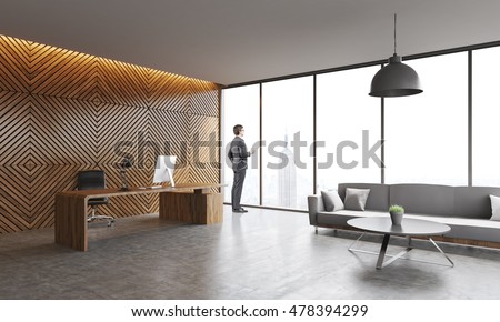 Businessman in suit standing in New York company office looking to window and thinking. Concept of CEO work. 3d rendering. 