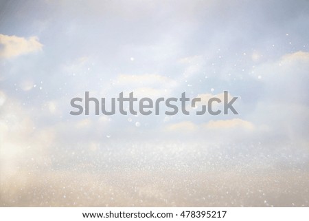 abstract photo of clouds burst in the sky. glitter overlay