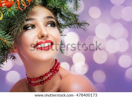 The girl in a wreath of fir branches