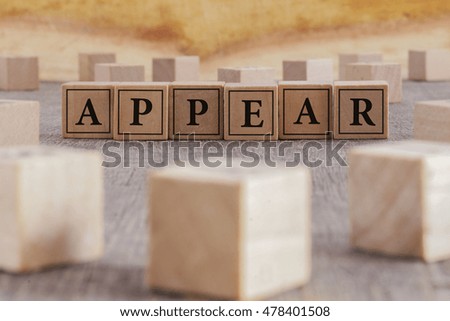 APPEAR word written on building blocks concept