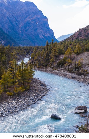 Landscape Fast Mountains River Hiking Himalayas.Beautiful View Waterfalls Asia End Summer Season Background.Green Threes Cloudy Blue Sky Mountainous Rocks Nobody Image.Vertical Photo