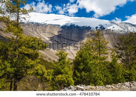 Landscapes Snow Mountains Nature Morning Viewpoint.Mountain Trekking Landscape Background. Nobody photo.Asia Horizontal picture. Sunlights White Clouds Blue Sky. Himalayas Rocks