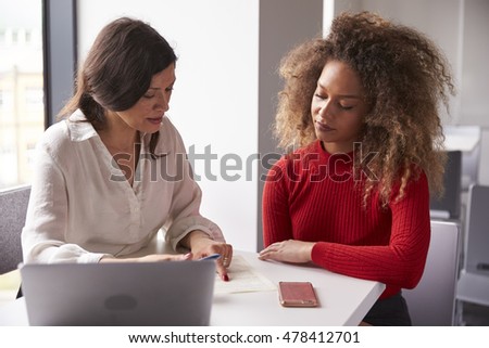 Female University Student Working One To One With Tutor Royalty-Free Stock Photo #478412701