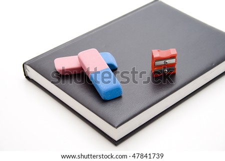 Eraser and sharpener on book