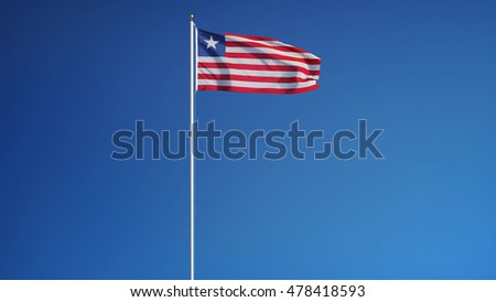 Liberia flag waving against clean blue sky, long shot, isolated with clipping path mask alpha channel transparency